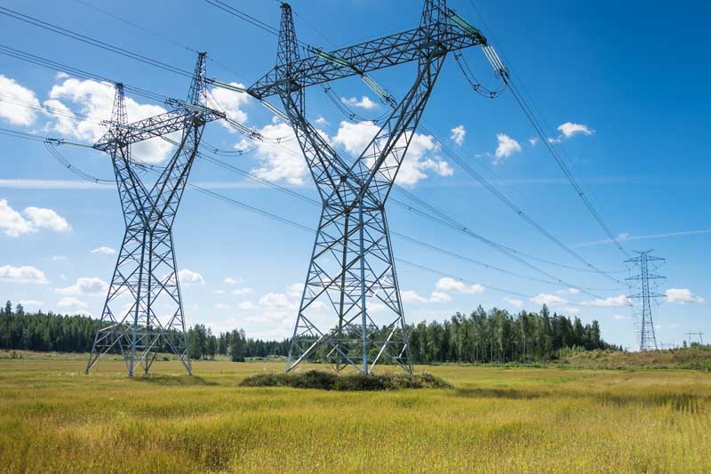 High-voltage Transmission Towers Under Blue Sky | IBEW Local 71