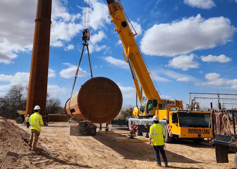 Lineman Erecting High Voltage Tower
