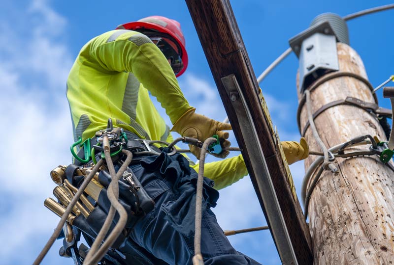 IBEW Lineman Performing Maintenance on a Utility Pole | IBEW Local 71