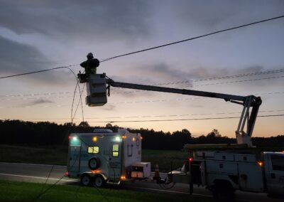 IBEW Local 71 Telecommunications Member Repairing Lines At Dusk